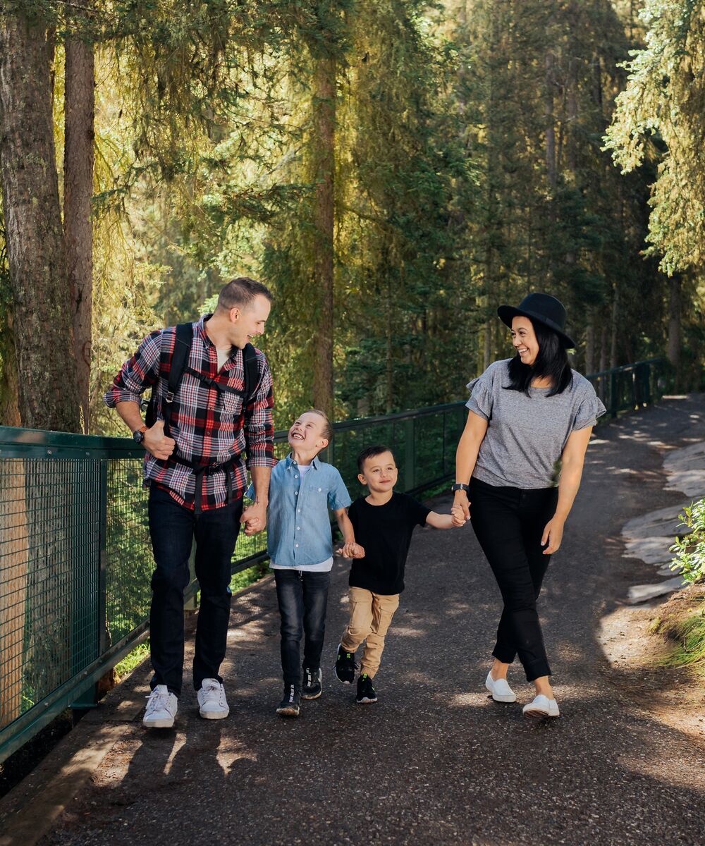 Family of four enjoying a hike at Johnston Canyon in Banff National Park